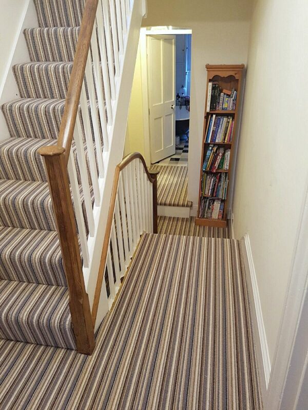 striped carpet on stairs and landing Premier Flooring Group